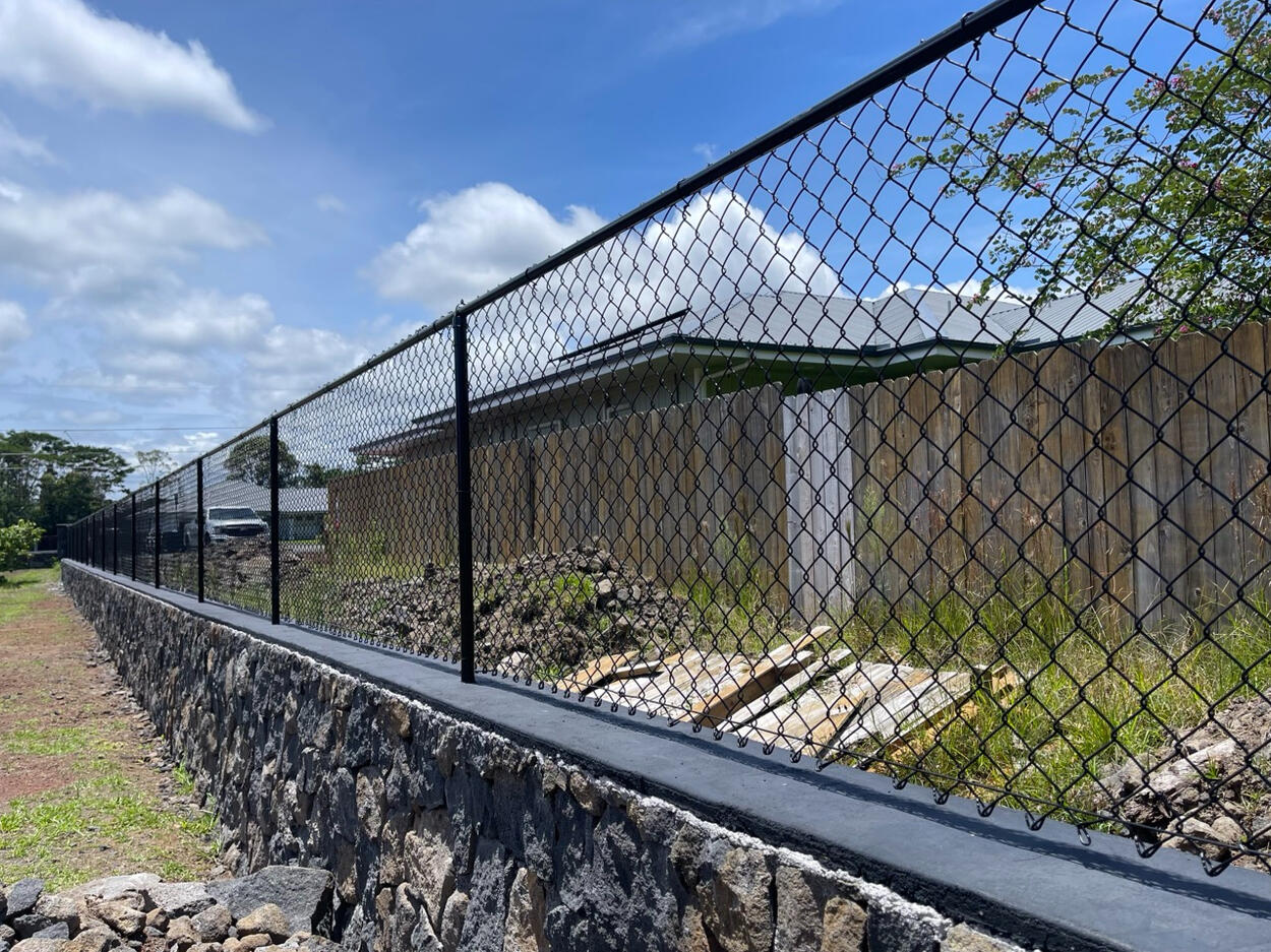 Rock wall with fencing